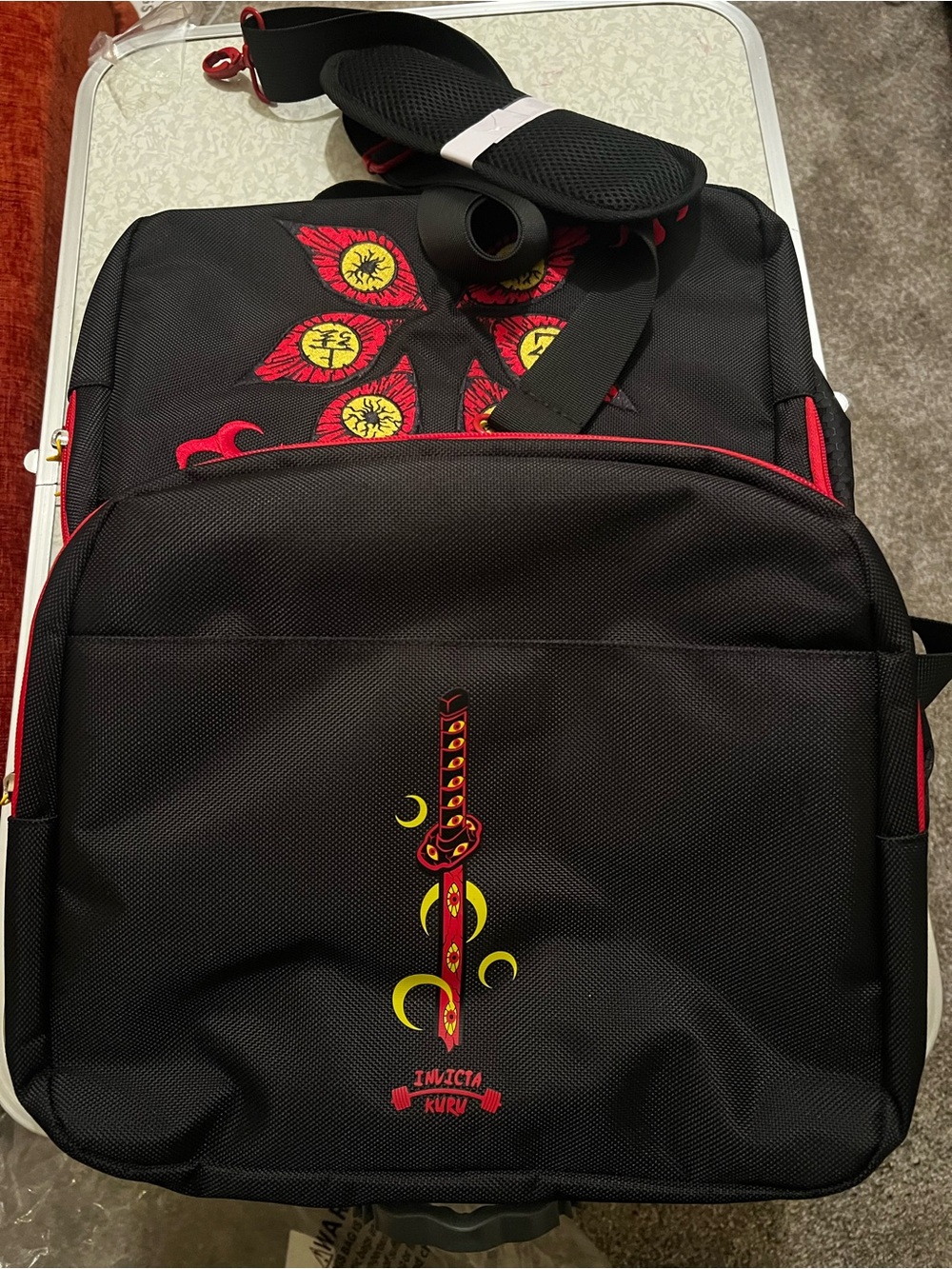 Invicta Black Backpack with Red and Yellow Graphic Accents